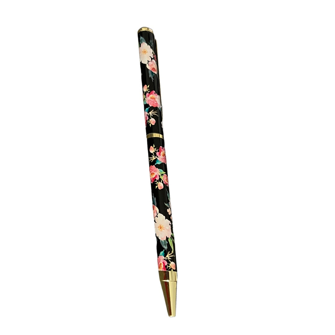 a black pen with flowers and gold accents